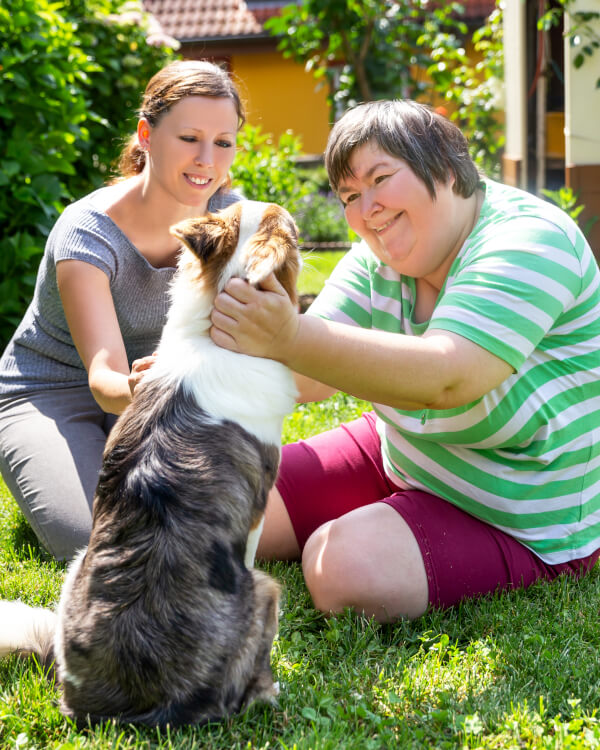 woman with carer and dog